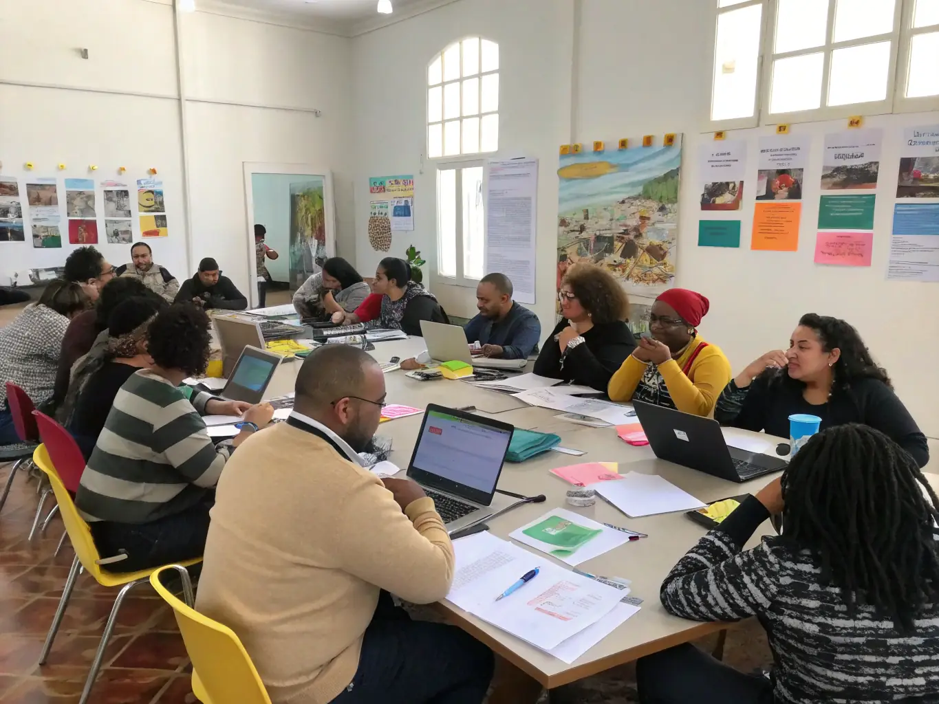 A photo of diverse community members participating in a collaborative workshop or event, highlighting the agency's commitment to community engagement.